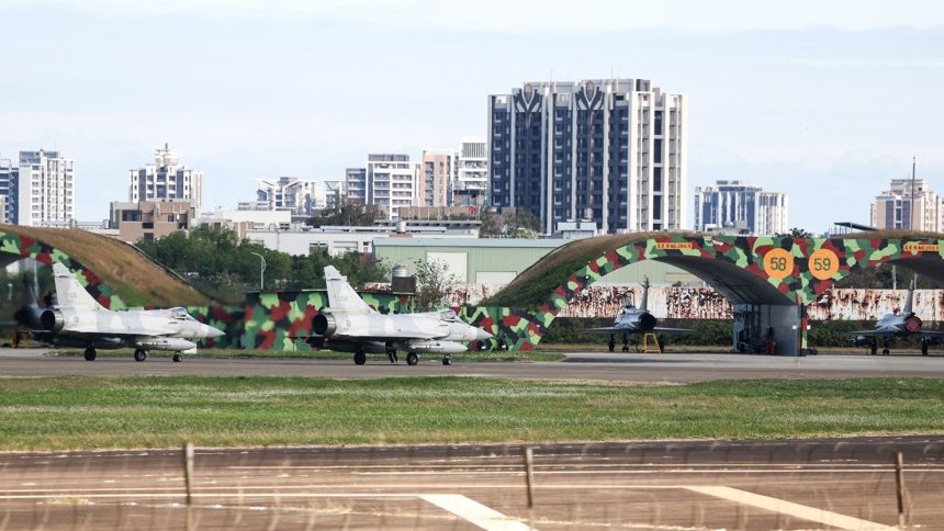 Two Taiwanese Air Force Mirage 2000 fighter jets prepare to take off at an air force base in northwestern Taiwan's Hsinchu on December 10.