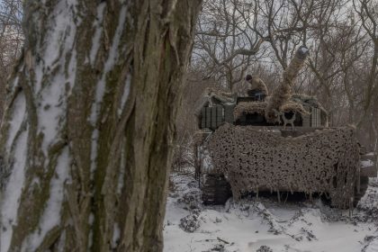 A Ukrainian crew member stands on a Leopard 1A5 tank near Pokrovsk in Ukraine's eastern Donetsk region on December 13.