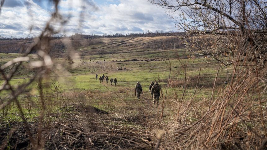 Ukrainian servicemen are seen on a training exercise near the city of Pokrovsk on December 18, 2024.