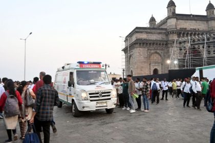 Passengers receive medical attention after a boat capsized off the coast in Mumbai, India on December 18.