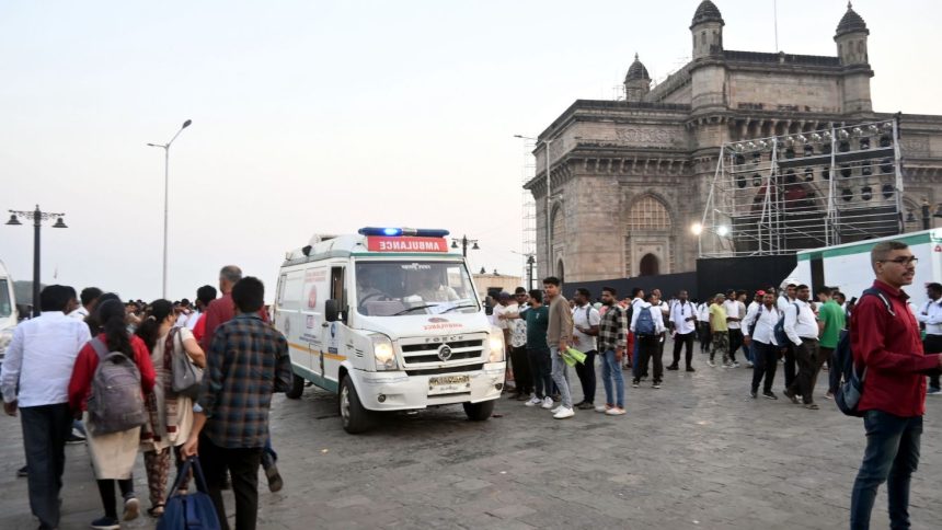 Passengers receive medical attention after a boat capsized off the coast in Mumbai, India on December 18.