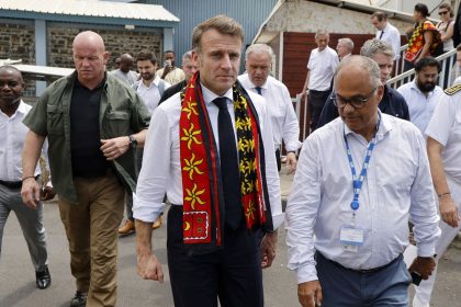 France's President Emmanuel Macron, center, visit the Mayotte Hospital Centre in Mamoudzou on December 19.