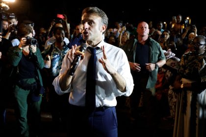 French President Emmanuel Macron speaks to the local residents during his visit in Pamandzi, on the French Indian Ocean territory of Mayotte on December 19, 2024.