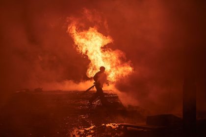 Ukrainian first responders work at the site of a Russian missile assault on the city center of Kyiv, Ukraine, on December 20, 2024.