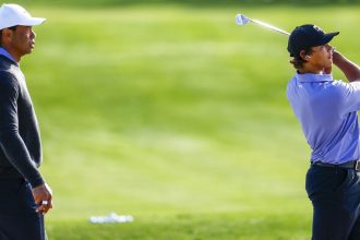 Tiger Woods and son Charlie Woods warm up on Friday ahead of the PNC Championship.