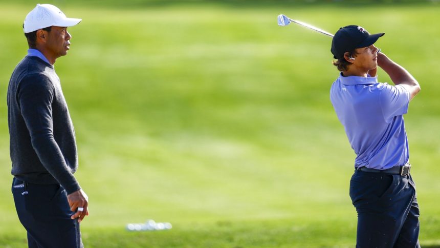 Tiger Woods and son Charlie Woods warm up on Friday ahead of the PNC Championship.