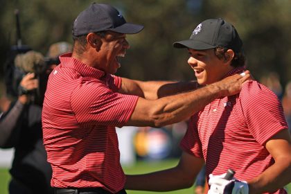 Tiger Woods and his son Charlie Woods celebrate after Charlie hit a hole-in-one at the PNC Championship.