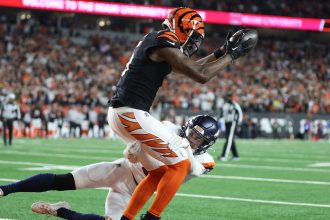 Tee Higgins of the Cincinnati Bengals catches the game-winning touchdown in overtime to defeat the Denver Broncos.