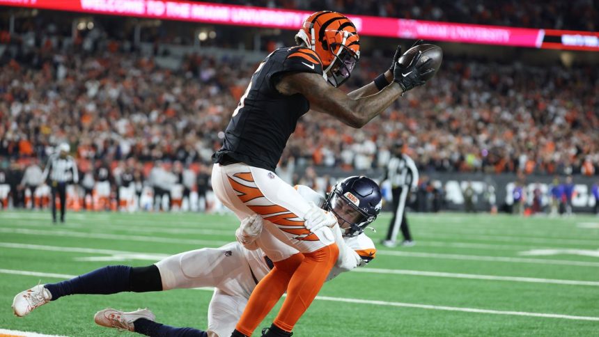 Tee Higgins of the Cincinnati Bengals catches the game-winning touchdown in overtime to defeat the Denver Broncos.