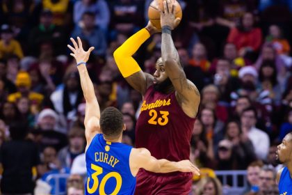 CLEVELAND, OH - DECEMBER 25: LeBron James #23 of the Cleveland Cavaliers passes while under pressure from Stephen Curry #30 of the Golden State Warriors during the first half at Quicken Loans Arena on December 25, 2016 in Cleveland, Ohio. NOTE TO USER: User expressly acknowledges and agrees that, by downloading and/or using this photograph, user is consenting to the terms and conditions of the Getty Images License Agreement. Mandatory copyright notice. (Photo by Jason Miller/Getty Images)