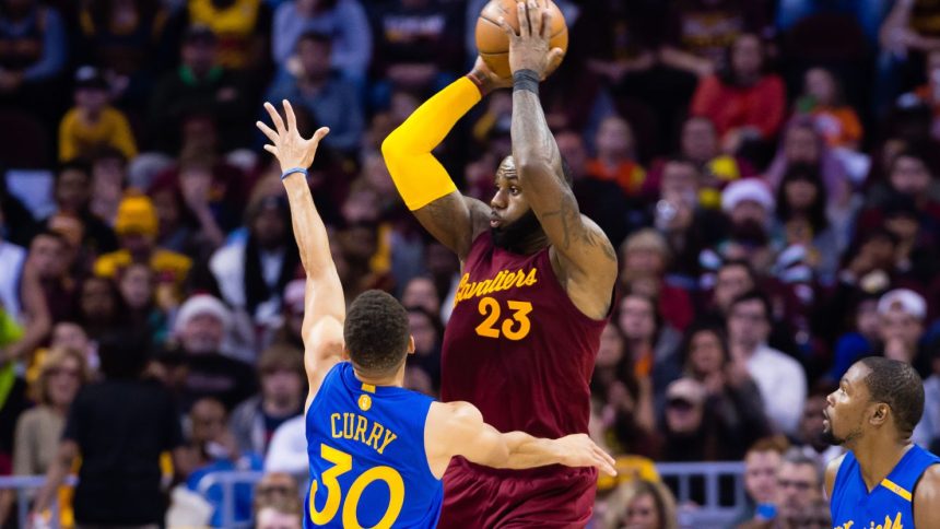 CLEVELAND, OH - DECEMBER 25: LeBron James #23 of the Cleveland Cavaliers passes while under pressure from Stephen Curry #30 of the Golden State Warriors during the first half at Quicken Loans Arena on December 25, 2016 in Cleveland, Ohio. NOTE TO USER: User expressly acknowledges and agrees that, by downloading and/or using this photograph, user is consenting to the terms and conditions of the Getty Images License Agreement. Mandatory copyright notice. (Photo by Jason Miller/Getty Images)