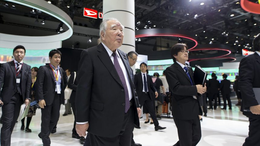 Suzuki Chairman Osamu Suzuki, center, at the Tokyo Motor Show on October 25, 2017. Suzuki died on December 25 at age 94.