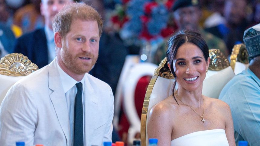 Prince Harry and Meghan pictured in Nigeria in May.