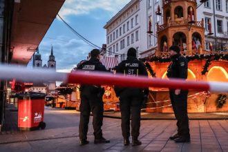 Police patrol next to the targeted Christmas market in Magdeburg, Germany, on Sunday.