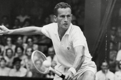 Neale Fraser in action at the 1957 Wimbledon Championships.