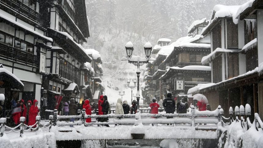 Snow covers Ginzan Onsen, a hot spring resort in Obanazawa, Yamagata Prefecture, northeastern Japan, on December 23, 2024.