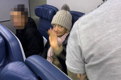 The stowaway identified by French authorities as Svetlana Dali prepares to disembark a flight that arrived in New York on Wednesday. CNN has blurred a portion of this image.