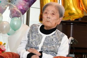 Tomiko Itooka celebrating her 116th birthday at the nursing home she lived at in Ashiya, western Japan.