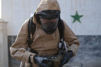 Volunteers from the Syrian Civil Defense, the volunteer organization also known as the White Helmets, inspect the site of a suspected Assad regime chemical laboratory inside a State Security facility in Damascus, Syria.