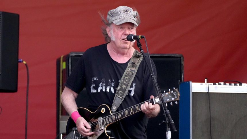 Neil Young performing at the 2024 New Orleans Jazz & Heritage Festival.