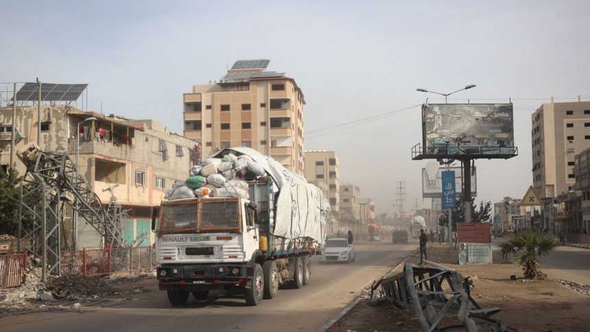 A truck carrying humanitarian aid drives in central Gaza.