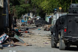 Police patrol around Bernard Mevs hospital where armed gangs have spread violence in Port-au-Prince on December 17, 2024.