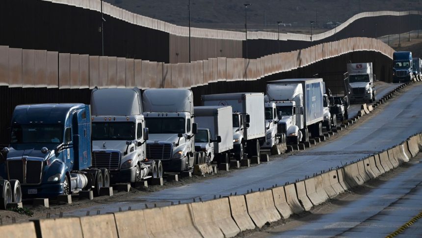 Tractor trailers wait in line at the Otay Mesa Port of Entry, on the US-Mexico border in Tijuana, Baja California, Mexico.