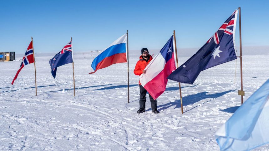 Chilean President Gabriel Boric displays his country's flag at the South Pole in a photo posted to his X account.