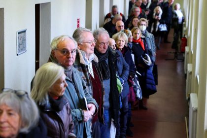 People queue to vote in an advanced postal ballot for the upcoming general elections at Steglitz-Zehlendorf district postal ballot polling station, in Berlin, Germany, on February 10, 2025.