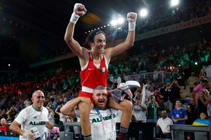 Algeria's Imane Khelif celebrates winning at the Olympics.