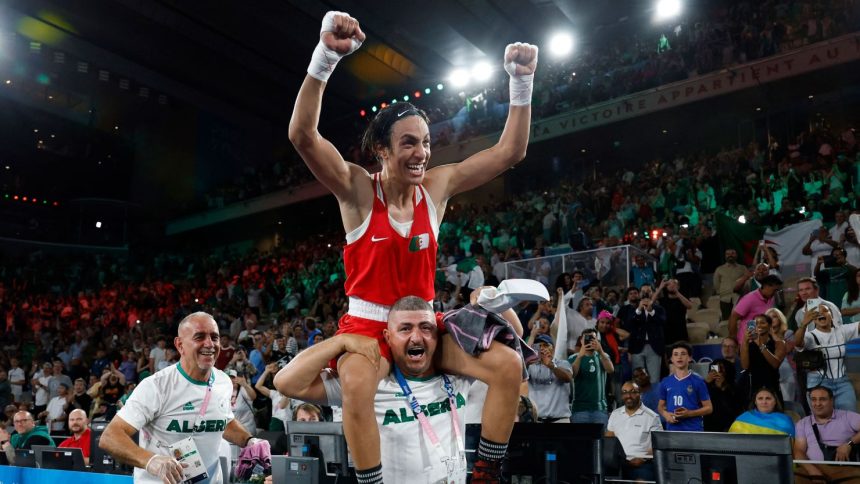 Algeria's Imane Khelif celebrates winning at the Olympics.