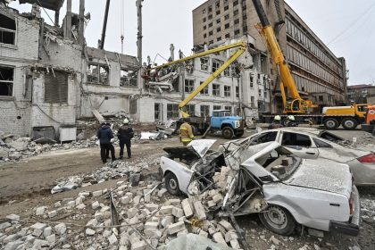 Rescuers work at a site where a building was heavily damaged by a Russian missile strike in Zaporizhzhia, Ukraine, on December 11, 2024.