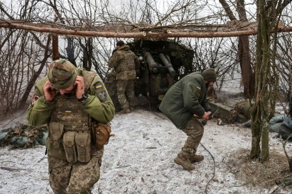 Ukrainian troops fire a howitzer toward Russian positions near Pokrovsk, Donetsk region, Ukraine, February 6, 2025.