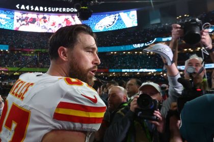 Kansas City Chiefs tight end Travis Kelce on the field after losing to the Philadelphia Eagles in Super Bowl LIX.