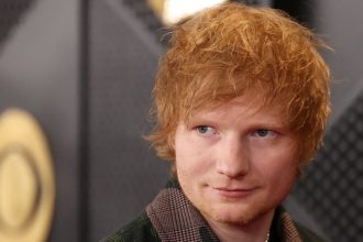 Ed Sheeran poses on the red carpet at the 66th Annual Grammy Awards in Los Angeles, on February 4, 2024.