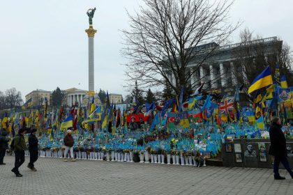 People visit a makeshift memorial for fallen Ukrainian soldiers during Russia's war on Ukraine at Independence Square in Kyiv in February 2025.