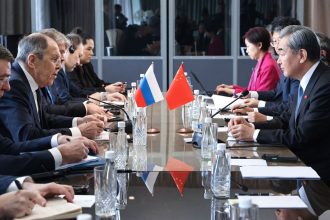 Russian Foreign Minister Sergei Lavrov and Chinese counterpart Wang Yi meet on the sidelines of a G20 gathering in Johannesburg on February 20.