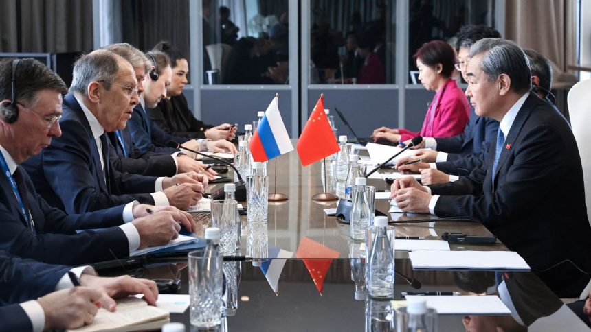 Russian Foreign Minister Sergei Lavrov and Chinese counterpart Wang Yi meet on the sidelines of a G20 gathering in Johannesburg on February 20.