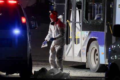 Forensic personnel inspect the area where a bus exploded, in Bat Yam, south of Tel Aviv, Israel.