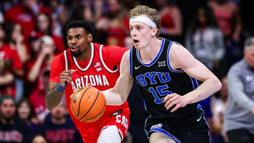 BYU guard Richie Saunders (No. 15) hit two late free throws to help the Cougars record a famous victory over the No. 19 Arizona Wildcats.