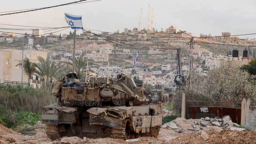 An Israeli tank in Jenin on Sunday.