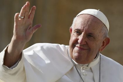 Pope Francis (L) waves at the end of his weekly general audience at Saint Peter's Square in the Vatican on October 26, 2022. (Photo by Vincenzo PINTO / AFP) (Photo by VINCENZO PINTO/AFP via Getty Images)