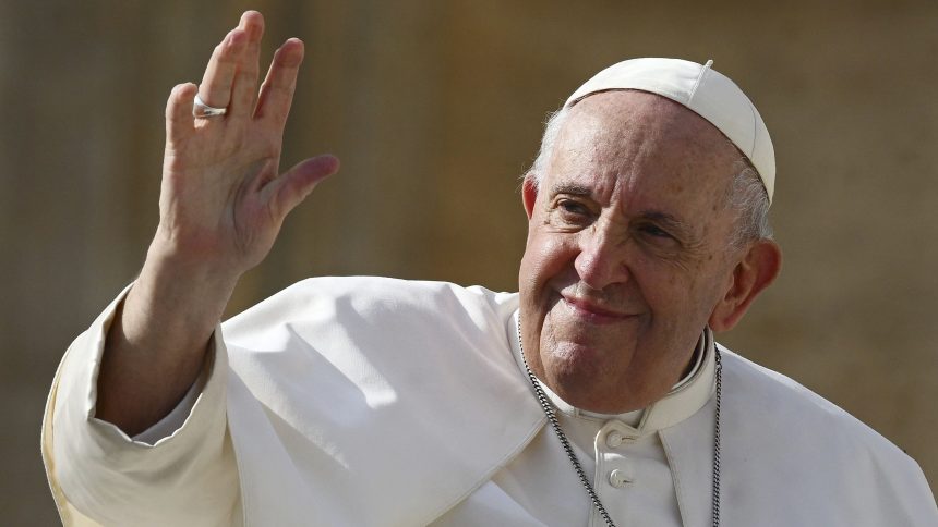 Pope Francis (L) waves at the end of his weekly general audience at Saint Peter's Square in the Vatican on October 26, 2022. (Photo by Vincenzo PINTO / AFP) (Photo by VINCENZO PINTO/AFP via Getty Images)