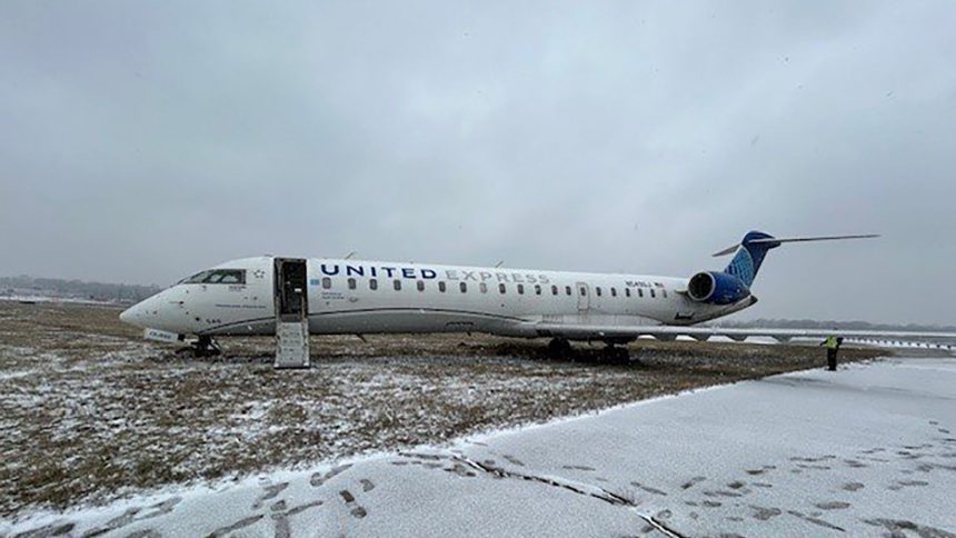 A plane carrying 27 passengers, including crew, slid off the taxiway and came to a stop on a grassy area at St. Louis Lambert International Airport on Wednesday.