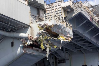 Exterior damage to the aircraft carrier USS Harry S. Truman viewed from a ship’s rigid-hull inflatable boat following a collision with merchant vessel on February 12 off Egypt.