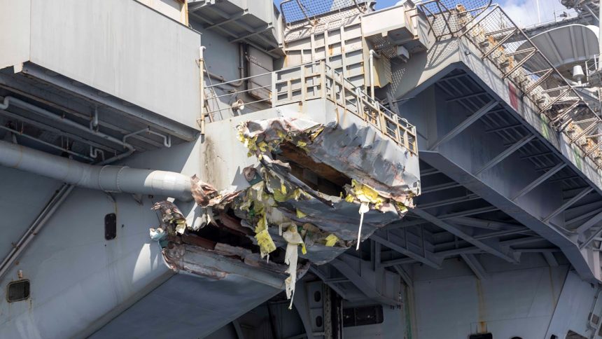 Exterior damage to the aircraft carrier USS Harry S. Truman viewed from a ship’s rigid-hull inflatable boat following a collision with merchant vessel on February 12 off Egypt.