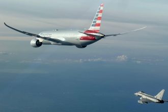 An Italian Air Force photo shows a jet escorting an American Airlines plane to Rome on Sunday, February 23, 2025.