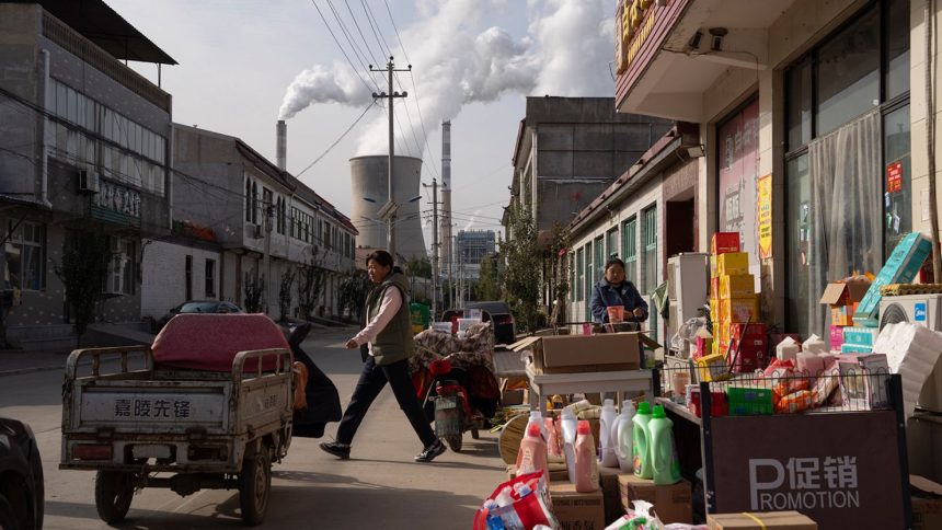 A coal-fired power plant seen from a street in Dingzhou, Baoding, in the northern China's Hebei province on November 10, 2023