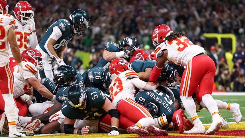 Philadelphia Eagles quarterback Jalen Hurts scores a touchdown on the "Tush Push" play during the team's Super Bowl win against the Kansas City Chiefs.