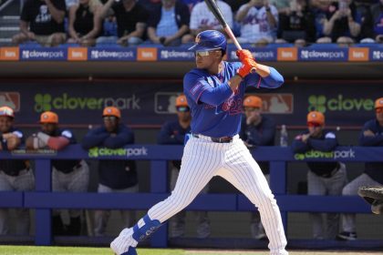 New York Mets' Juan Soto bats during the first inning of a spring training baseball game against the Houston Astros Saturday, Feb. 22, 2025, in Port St. Lucie, Fla. (AP Photo/Jeff Roberson)